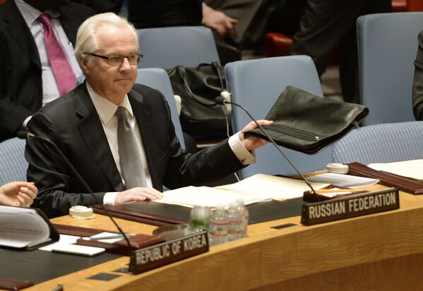 ممثل روسيا الدائم لدى الأمم المتحدة فيتالي تشوركين بمجلس الأمن خلال مناقشة أوضاع أوكرانيا، نيويورك، 13 مارس/ آذار 2014 - سبوتنيك عربي
