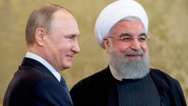 الرئيس الروسي فلاديمير بوتين مع نظيره الإيراني حسن روحاني - سبوتنيك عربي