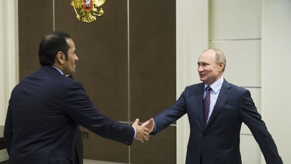 Russian President Vladimir Putin, right, shakes hands with Qatar Foreign Minister Mohammed bin Abdulrahman bin Jassim Al-Thani before their meeting in Sochi, Russia, Friday, May 6, 2016 - سبوتنيك عربي