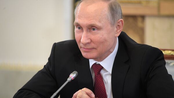 Russian President Vladimir Putin speaks during a meeting with representatives of international news agencies in St. Petersburg, Russia - سبوتنيك عربي