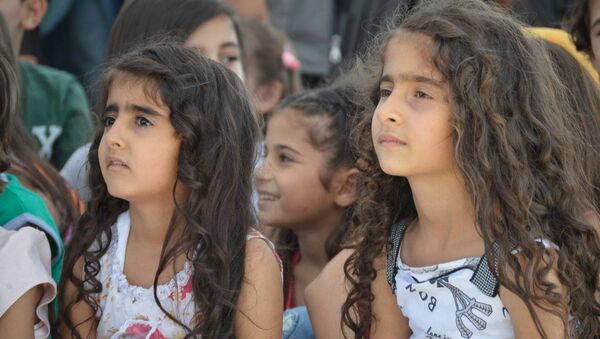 أبناء الشهداء يحتفلون بالعيد في اللاذقية - سبوتنيك عربي