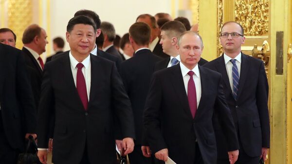لقاء الرئيس الروسي فلاديمير بوتين ونظيره الصيني في موسكو (4 يوليو 2017) - سبوتنيك عربي