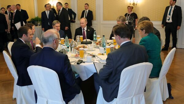 اجتماع بوتين و ماكرون و ميركل - سبوتنيك عربي
