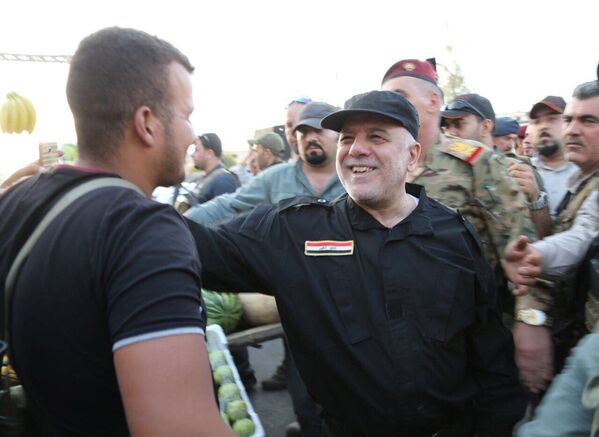 رئيس الوزراء العراقي حيدر العبادي يزور الموصل بعد تحريرها، العراق، 9 يوليو/ تموز 2017 - سبوتنيك عربي