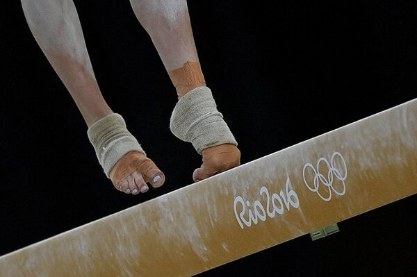 جائزة ستينين للتصوير المحترف في فئة الرياضة - صورة للمصور أليكسي فيليبوف بعنوان على أطراف الأصابع (صورة للرياضية الكندية إزابيللا أونيشكو خلال الألعاب الأولمبية  الصيفية) - سبوتنيك عربي