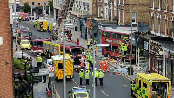 Emergency services attend the scene of a bus crash in Lavender Hill, London August 10, 2017 in this picture obtained on social media - سبوتنيك عربي