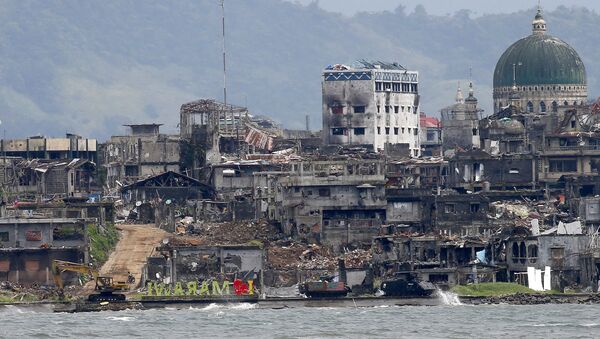 آثار الدمار في مدينة مراوي، بعد معارك شرسة ضد إرهابيي تنظيم داعش، الفلبين 25 أكتوبر/ تشرين الأول 2017 - سبوتنيك عربي