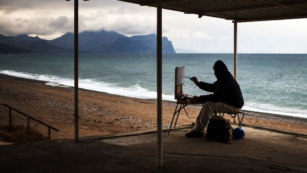 فنان يرسم على شاطئ سيفاستوبل، القرم، روسيا - سبوتنيك عربي