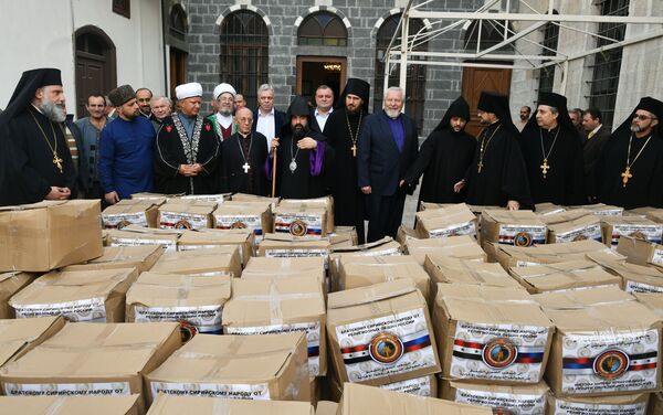 وفد من الشخصيات الدينية في روسيا يزور دمشق - توزيع المساعدات الإنسانية - سبوتنيك عربي
