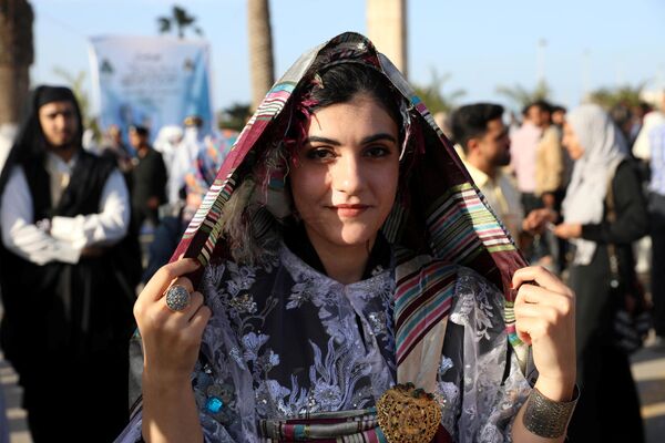 إحدى المشاركات في المهرجان الوطني للزي التقليدي في طرابلس، ليبيا 13 ماري/ آذار 2018 - سبوتنيك عربي