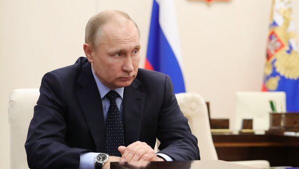 الرئيس الروسي فلاديمير بوتين خلال اجتماع حول تحقيق بحادثة كيميروفو، 28 مارس/آذار - سبوتنيك عربي