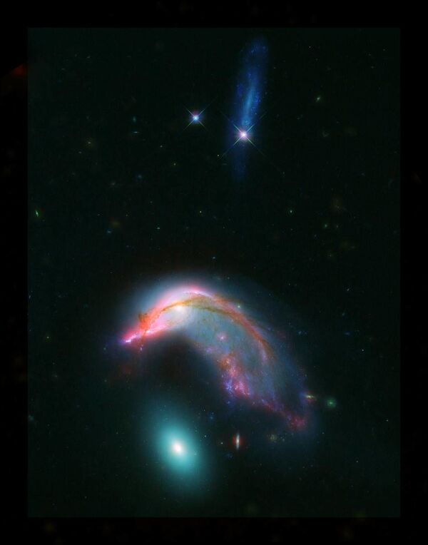 المجرات المترابطة Arp 142 - تشبه في شكلها البطريق - سبوتنيك عربي