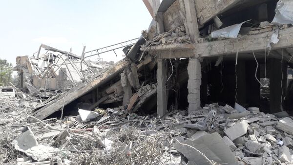 ضربات التحالف الثلاثي التي طالت مركز البحوث العلمية في برزة، سوريا 14 أبريل/ نيسان 2018 - سبوتنيك عربي