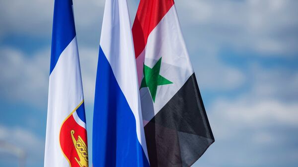 العلم الروسي و السوري - سبوتنيك عربي