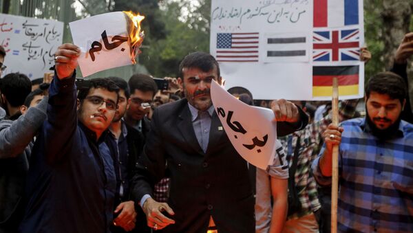 احتجاجات في طهران بعد خروج دونالد ترامب من صفقة الاتفاق النووي مع إيران، 9 مايو/ أيار 2018 - سبوتنيك عربي