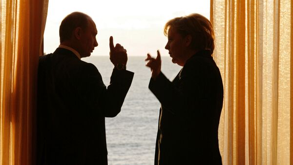 الرئيس الروسي فلاديمير بوتين والمستشارة الألمانية انجيلا ميركل - سبوتنيك عربي