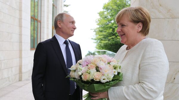 لقاء الرئيس الروسي فلاديمير بوتين والمستشارة الألمانية انجيلا ميركل - سبوتنيك عربي