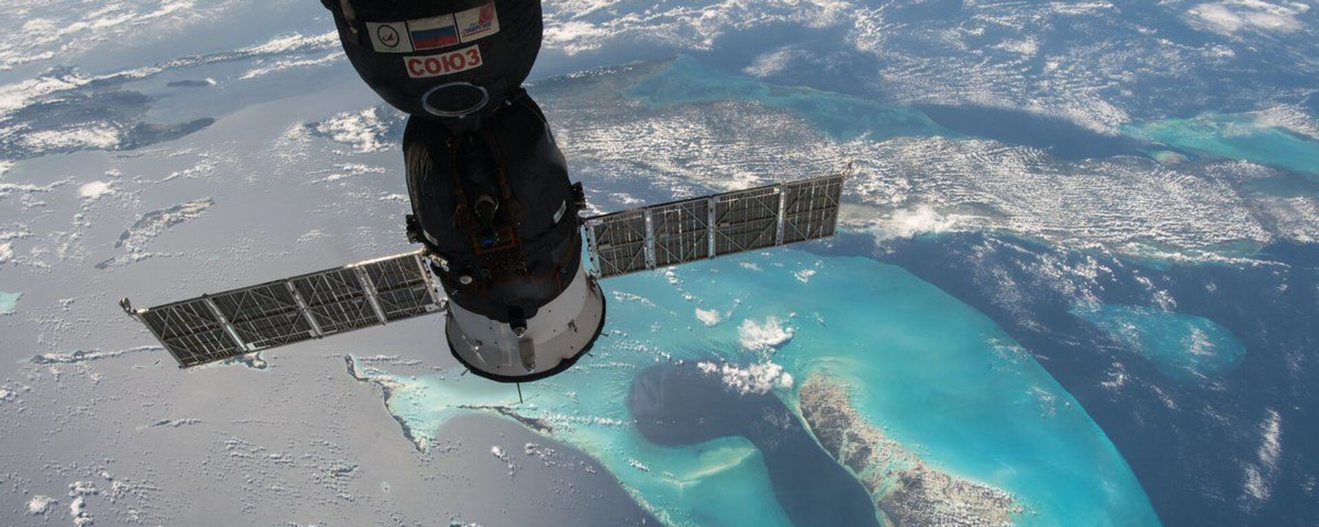 مشهد من محطة الفضاء الدولية يطل على المركبة الفضائية الروسية سويوز - سبوتنيك عربي, 1920, 21.04.2021