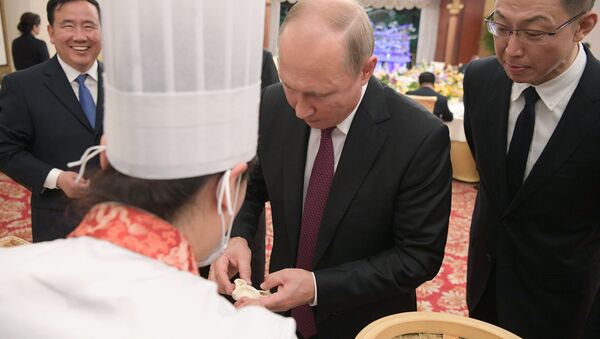 الرئيس الروسي فلاديمير بوتين في الصين (8 يونيو/حزيران 2018) - سبوتنيك عربي