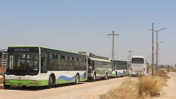 حافلات تقل المسلحين من درعا إلى الشمال السوري - سبوتنيك عربي