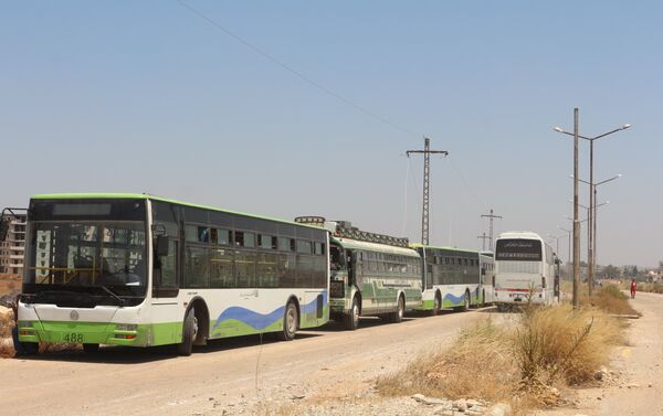 حافلات تقل المسلحين من درعا إلى الشمال السوري - سبوتنيك عربي