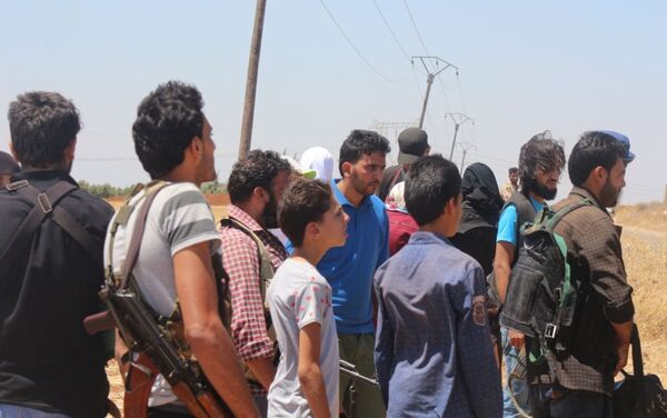 خروج المسلحين من بلدة محجة شمالي محافظة درعا - سبوتنيك عربي