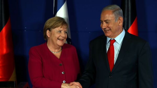 المستشارة الألمانية أنغيلا ميركيل خلال مؤتمر صحفي مع رئيس الوزراء الإسرائيلي بنيامين نتنياهو - سبوتنيك عربي