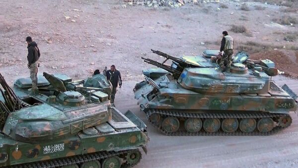 المسلحون يسلمون آليات حربية إلى القوات الحكومية السورية - سبوتنيك عربي