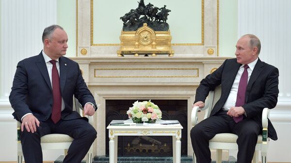 الرئيس المولدوفي إيغور دودون و الرئيس الروسي فلاديمير بوتين - سبوتنيك عربي