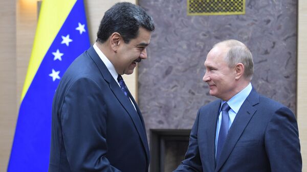 الرئيس الروسي فلاديمير بوتين ونظيره الفنزويلي نيكولاس مادورو - سبوتنيك عربي