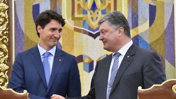 رئيس الوزراء الكندي جاستين ترودو ورئيس أوكرانيا يبترو بوروشينكو في مؤتمر صحفي في كييف - سبوتنيك عربي