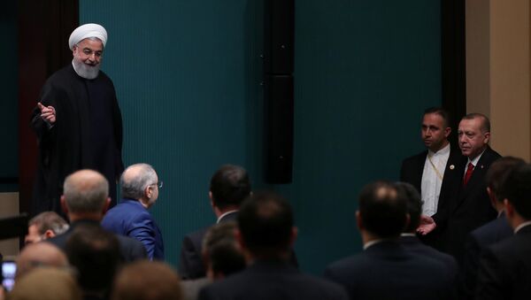 الرئيس الإيراني حسن روحاني في مؤتمر صحفي مشترك مع نظيره التركي في أنقرة - سبوتنيك عربي