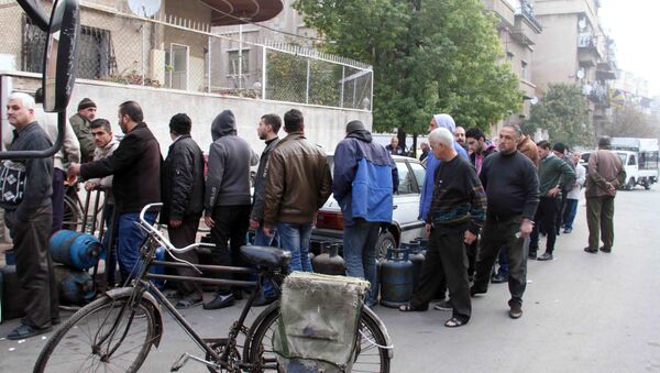 توزيع مادة الغاز في دمشق - سبوتنيك عربي