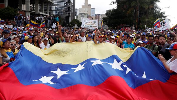 مظاهرات في كاراكاس، فنزويلا 23 يناير/ كانون الثاني 2019 - سبوتنيك عربي