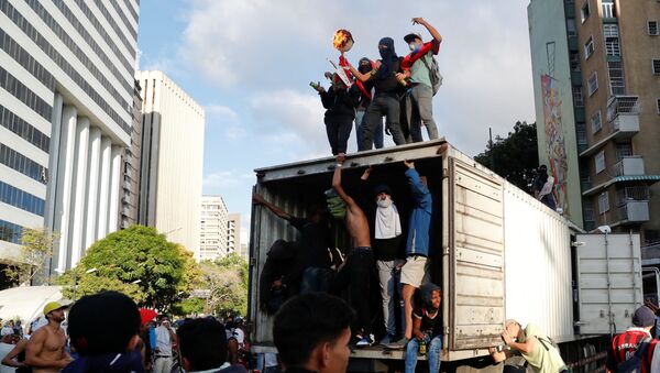 مظاهرات في كاراكاس، فنزويلا 23 يناير/ كانون الثاني 2019 - سبوتنيك عربي