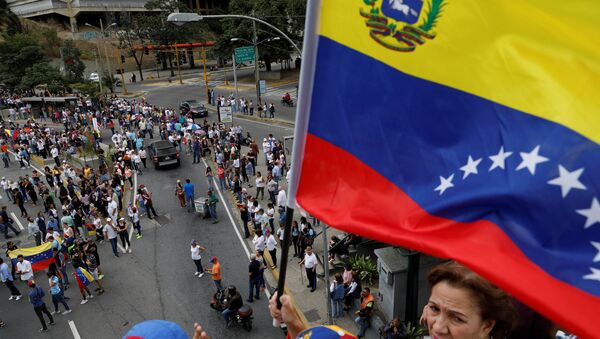 مظاهرات داعمة لزعيم المعارضة الفنزويلية خوان غوايدو في كاراكاس، فنزويلا  30 يناير / كانون الثاني 2019 - سبوتنيك عربي