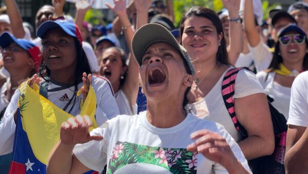 مظاهرات المعارضة الفنزويلية (خوان غوايدو) في كاراكاس، فنزويلا فبراير/ شباط 2019 - سبوتنيك عربي
