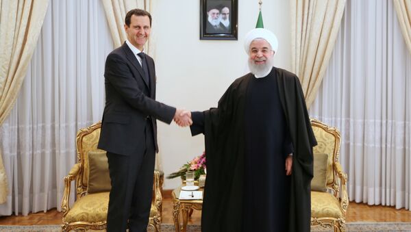 الرئيس الإيراني حسن روحاني يستقبل الرئيس السوري بشار الأسد في طهران - سبوتنيك عربي