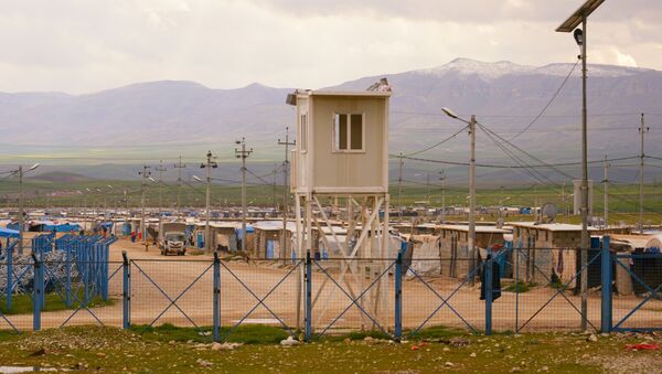 اللاجئون السوريون والعراقيون في مخيم للاجئين/ النازحين بالقرب من السليمانية، كردستان العراق - سبوتنيك عربي