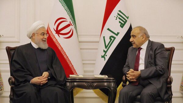 رئيس الوزراء العراقي عادل عبد المهدي مع الرئيس الإيراني حسن روحاني في بغداد في 11 مارس / أذار 2019 - سبوتنيك عربي