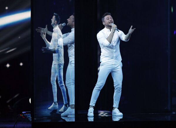 المغني الروسي سيرغي لازاريف يؤدي أغنية الصراخ في نهائي مسابقة الأغنية الأوروبية عام 2019 في تل أبيب 18 مايو/ أيار 2019 - سبوتنيك عربي
