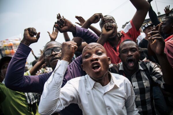 المشاركون في احتجاجات في عاصمة الكونغو كينشاسا، الكونغو 30 يونيو/ حزيران 2019 - سبوتنيك عربي