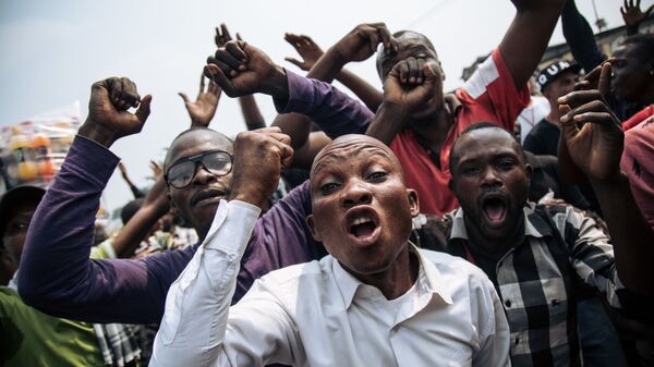 المشاركون في احتجاجات في عاصمة الكونغو كينشاسا، الكونغو 30 يونيو/ حزيران 2019 - سبوتنيك عربي