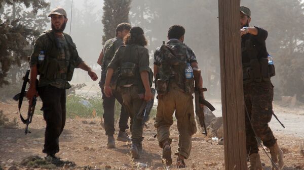 مقاتلين من تنظيم جبهة النصرة الإرهابي في الشمال السوري - سبوتنيك عربي
