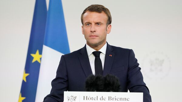 الرئيس الفرنسي إيمانويل ماكرونعشية الاحتفالات الوطنية بيوم الباستيل في فرنسا، 13 يوليو/تموز 2019 - سبوتنيك عربي