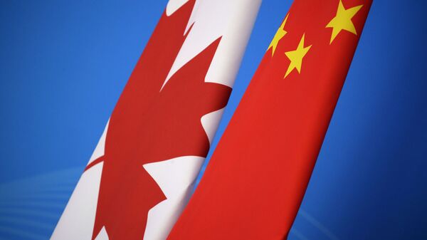 علم كندا و الصين  - سبوتنيك عربي