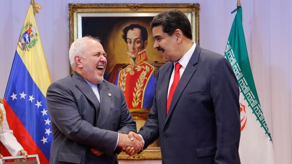 الرئيس الفنزويلي نيكولاس مادورو خلال لقائه مع وزير الخارجية الإيراني محمد جواد ظريف في كاراكاس، 20 يوليو/تموز 2019 - سبوتنيك عربي