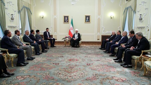 الرئيس الإيراني حسن روحاني يستقبل وزير خارجية سلطنة عمان يوسف بن علوي في طهران - سبوتنيك عربي