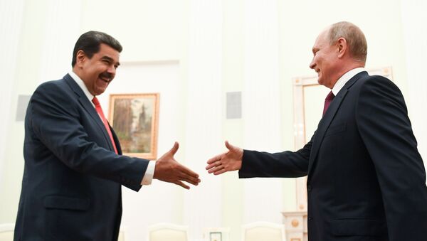 الرئيس الروسي فلاديمير بوتين خلال لقائه بنظيره الفنزويلي، نيكولاس مادورو - سبوتنيك عربي