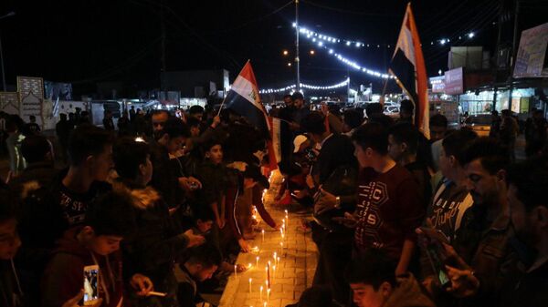 وقفة تضامنية مع ضحايا احتجاجات العراقية، شارع الزهور وسط مدينة تكريت، العراق ديسمبر 2019 - سبوتنيك عربي